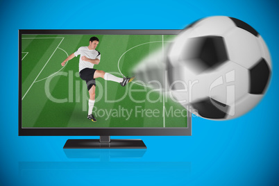 Football player in white kicking ball out of tv