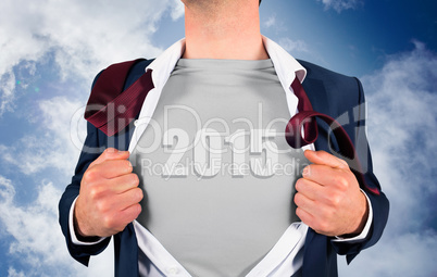 Composite image of businessman opening shirt in superhero style