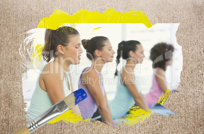 Composite image of yoga class in the gym