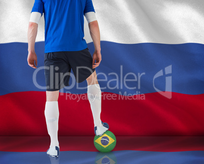 Football player standing with ball