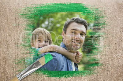 Composite image of father and son in the park