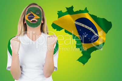 Excited brasil fan in face paint cheering