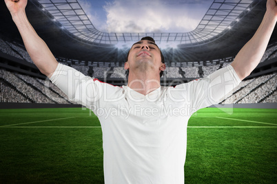 Excited football fan cheering