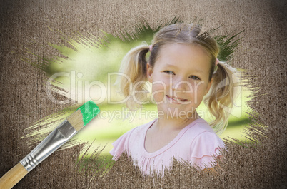 Composite image of little girl smiling in the park