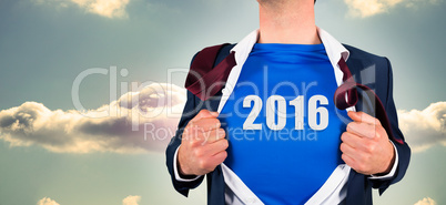 Composite image of businessman opening his shirt superhero style