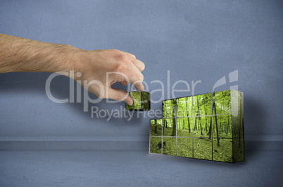 Composite image of hand building wall