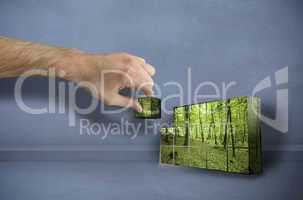 Composite image of hand building wall