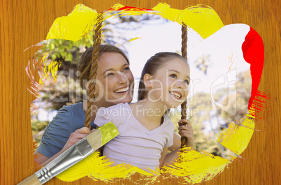 Composite image of mother and daughter in the park