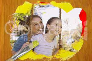 Composite image of mother and daughter in the park