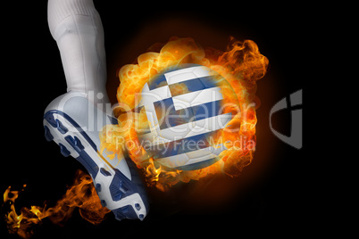 Football player kicking flaming greece flag ball