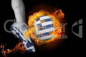 Football player kicking flaming greece flag ball