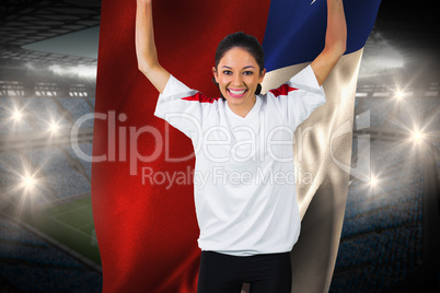 Football fan in white cheering holding chile flag