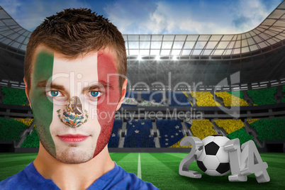 Serious young mexico fan with face paint