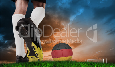 Composite image of football boot kicking germany ball