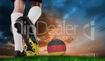 Composite image of football boot kicking germany ball