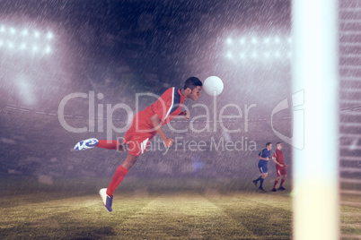 Composite image of football player in red jumping