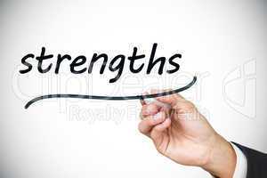 Businessman writing the word strengths