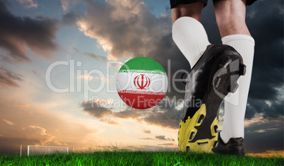 Composite image of football boot kicking iran ball