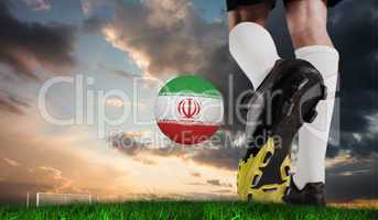 Composite image of football boot kicking iran ball