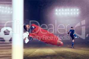 Composite image of goalkeeper in red making a save