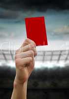 Composite image of hand holding up red card