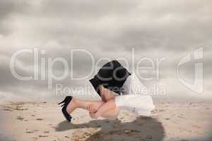 Composite image of businesswoman burying her head