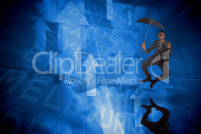 Composite image of businessman cheering and holding umbrella