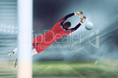 Composite image of goalkeeper in red jumping up