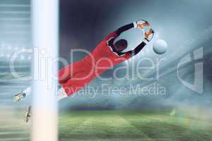 Composite image of goalkeeper in red jumping up