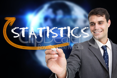 Businessman writing the word statistics