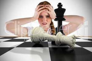 Composite image of stressed businesswoman with hands on head