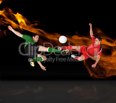 Composite image of football players tackling for the ball