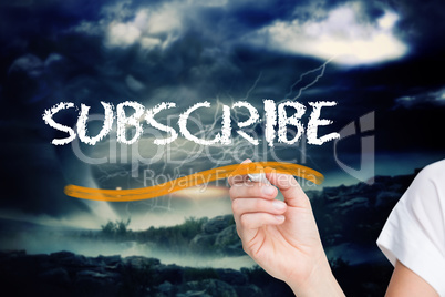 Businesswoman writing the word subscribe