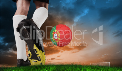 Composite image of football boot kicking portugal ball