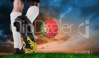 Composite image of football boot kicking portugal ball