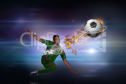 Composite image of football player in green kicking