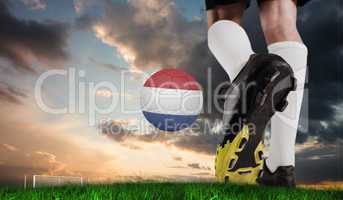 Composite image of football boot kicking dutch ball
