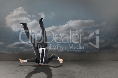 Composite image of businessman burying his head