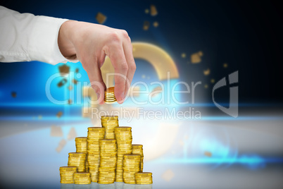 Composite image of businessman holding coins