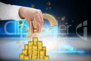 Composite image of businessman holding coins