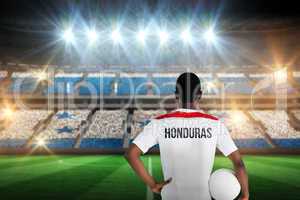 Composite image of honduras football player holding ball