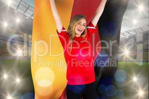 Composite image of cheering football fan in red holding german f