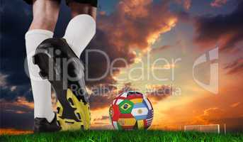 Composite image of football boot kicking flag ball