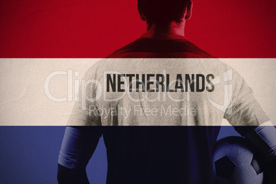 Composite image of netherlands football player holding ball