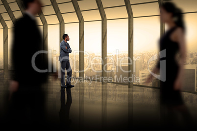 Composite image of business people walking in a blur