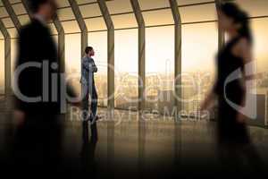 Composite image of business people walking in a blur