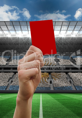 Composite image of hand holding up red card