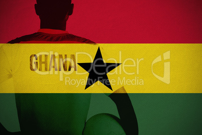 Composite image of ghana football player holding ball