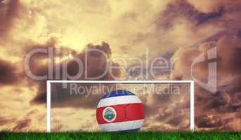 Composite image of football in costa rica colours