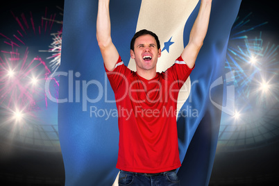 Composite image of cheering football fan in red